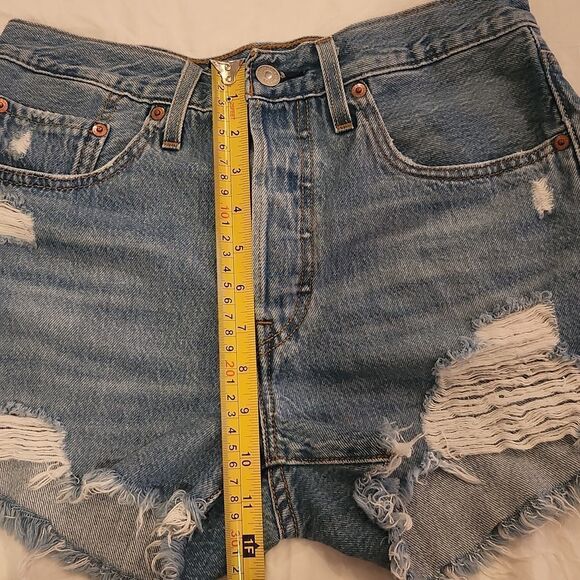Medium wash distressed button fly, high waist Levi's shorts size 27. - Picture 4 of 9